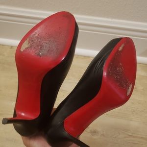 Christian Louboutin red bottom heels.